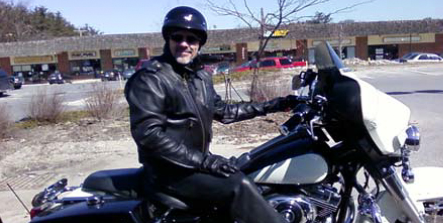 Closeup man with white beard on Motorcycle